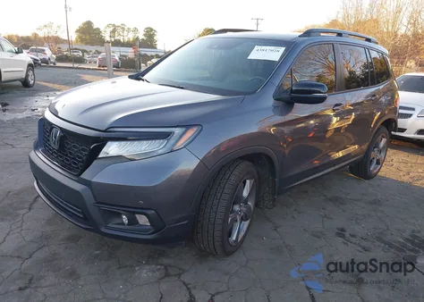 2021 Honda Passport 2Wd Touring z USA, uszkodzony, nr VIN 5FNYF7H98MB012918